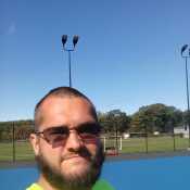 In the hot sun Coating tennis courts
