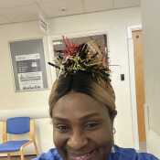 At work with my Christmas hat to lift the spirit of those who came in contact me.