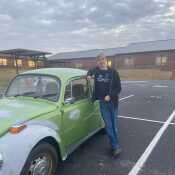 Me and my little green bug. Not much but it's a great little car