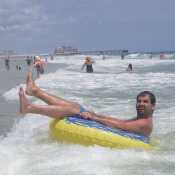 Riding the waves in the ocean on my tube.